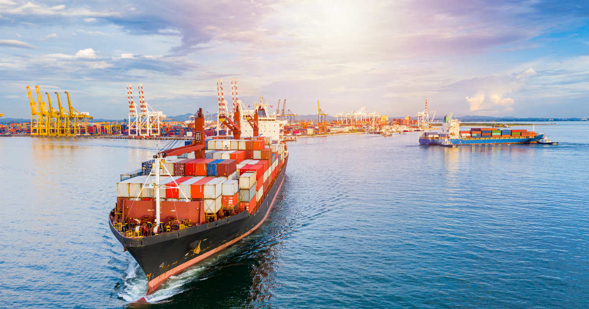 Container ship carrying container for business freight shipping import and export, Aerial view container ship arriving in commercial port.