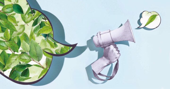 En megafon där det kommer ut ett grönt löv