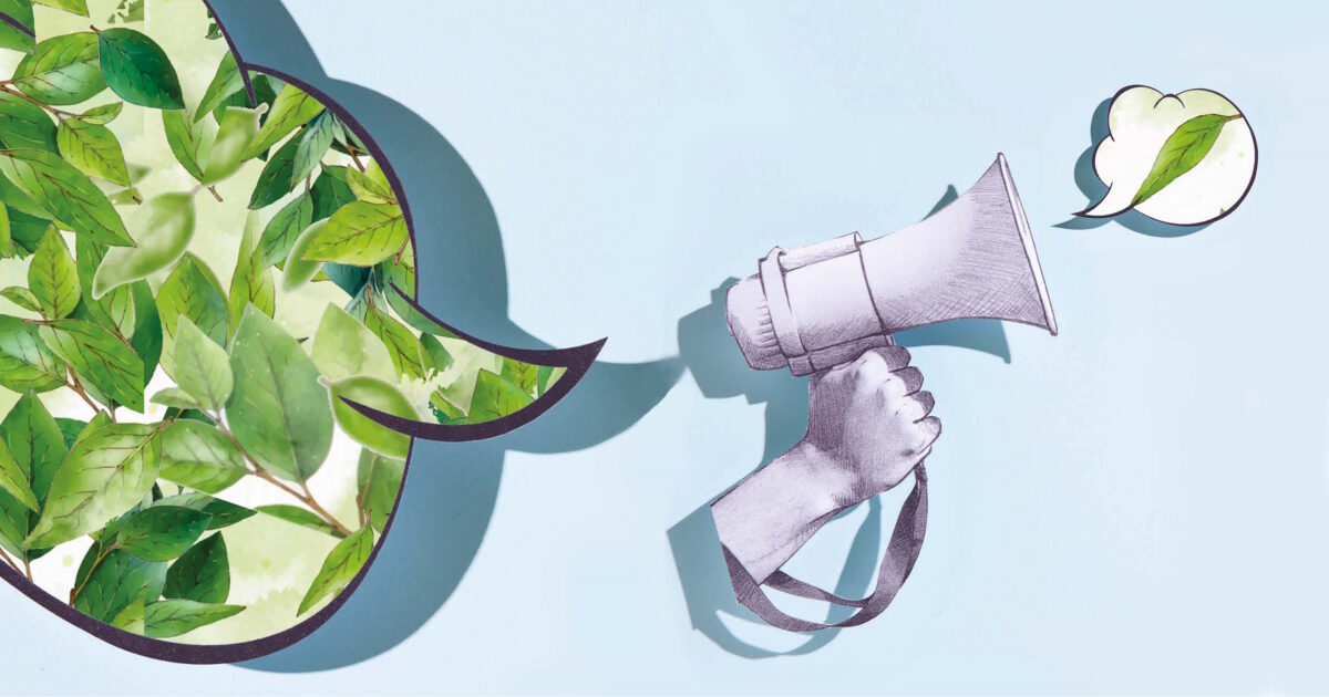 En megafon där det kommer ut ett grönt löv